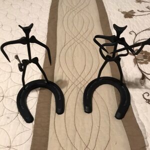Horseshoe metal sculptures. Gunslinger & guitar player.